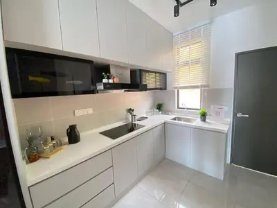 a kitchen with white cabinets and a sink at Scafie apartment 001