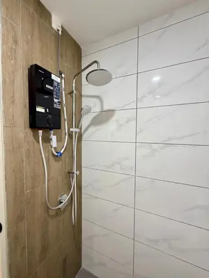 a shower in a bathroom with a glass wall at Piccadilly Ipoh by Iconique in Ipoh