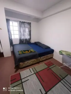 a bedroom with a bed and a window at RIADAH DALAM IBADAH by Rumah Che Matsunami in Brinchang