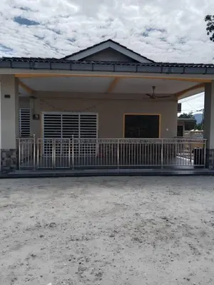 a small house with a large porch at Empatnurul Homestay Ipoh in Ipoh