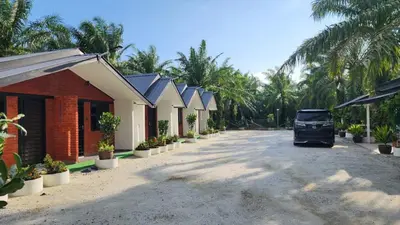 a truck parked in a parking lot next to a building at Swit60 Homestay in Sungai Besar