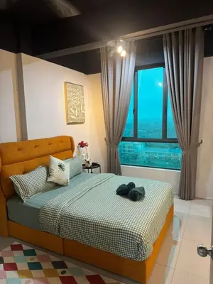 a bedroom with a bed and a large window at Idham homestay 2 in Ipoh