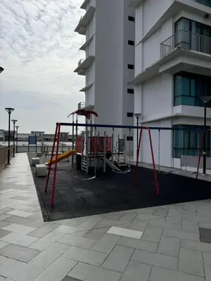 a playground in front of a building at Idham homestay 2 in Ipoh