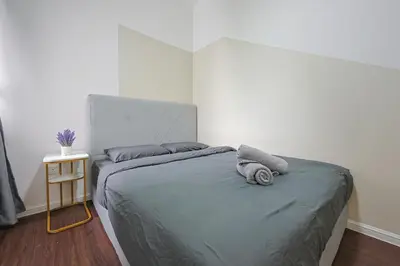 a bed with two pillows on it in a bedroom at Top 2 Palas Horizon Brinchang Cameron Highlands in Brinchang