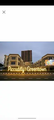 a building with a sign that reads paccarolis greenatown at LMS ipoh town in Ipoh