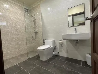 a bathroom with a toilet and a sink and a shower at Bao Sheng Durian Farm in Balik Pulau