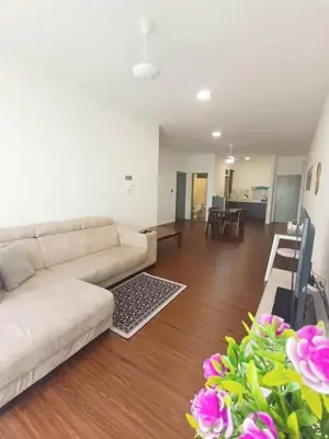a living room with a couch and a table at Norlinda palas homestay in Brinchang