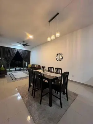 a dining room with a table and chairs at Norlinda palas homestay in Brinchang