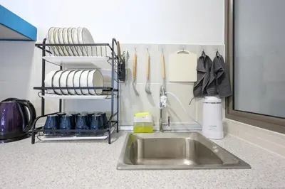 a kitchen counter with a stainless steel sink and utensils at Blueish Top 2 Palas Horizon brinchang Cameron Highland - C home Luxury B-2-4 in Brinchang