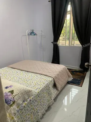 a bed sitting in a room with a window at Homestay D'Kutan Bandar Baharu Kedah in Bandar Baharu