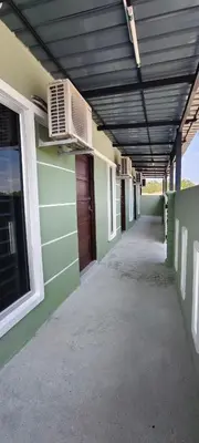 an empty hallway of a building with a ceiling at 3Q Impiana Roomstay Teluk Senangin in Lumut