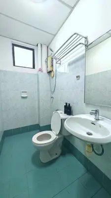 a bathroom with a toilet and a sink at Azure Haven by the Sea-Lumut in Lumut