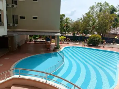 a swimming pool in the middle of a building at Azure Haven by the Sea-Lumut in Lumut