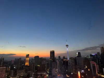 a view of a city skyline at sunset at Landmark View At Axon Residence Bukit Bintang Pavilion in Gua Sai