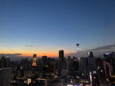 a view of a city skyline at sunset at Landmark View At Axon Residence Bukit Bintang Pavilion in Gua Sai