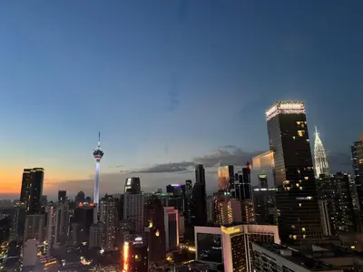 a view of a city skyline at night at Landmark View At Axon Residence Bukit Bintang Pavilion in Gua Sai