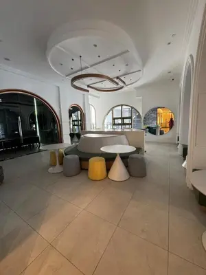 a large room with a table and yellow chairs at Lovecozy Home 22M Macalister in George Town