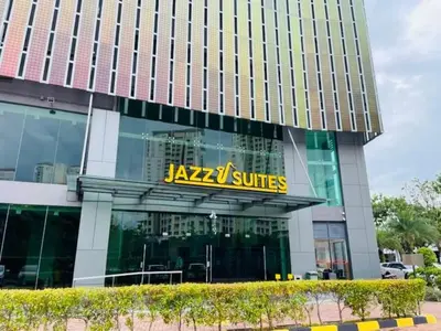 a building with a sign on the front of it at Luxury Sea view Sunset view Jazz Suites near Gurney in Tanjong Tokong