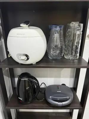 a shelf with a blender and glasses on it at De Ipoh Homestay in Tanjung Rambutan