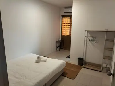 a bedroom with a white bed and a shower at \u5de5\u4e1a\u4f4f\u5bb6 in Lahat