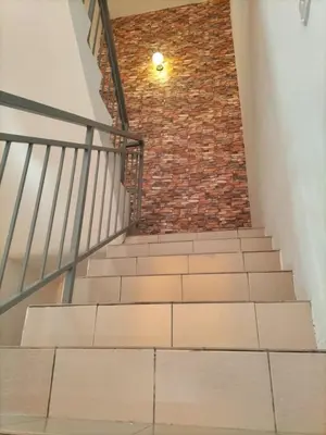 a staircase with a brick wall and a brick stair case at \u5de5\u4e1a\u4f4f\u5bb6 in Lahat
