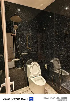 a bathroom with a toilet and a shower at Adik Aisyah Hotel Studio Room Royal Silver centrum Brinchang in Brinchang