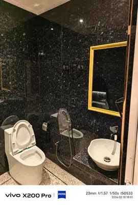 a bathroom with a toilet and a sink at Adik Aisyah Hotel Studio Room Royal Silver centrum Brinchang in Brinchang
