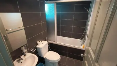 a small bathroom with a toilet and a sink at Kinta Riverfront Apartment Riverview Apartment in Ipoh