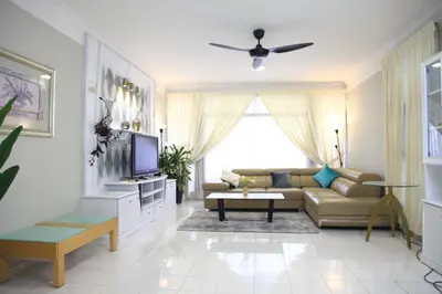 a living room with a couch and a tv at Isabella Villa George Town Penang in George Town