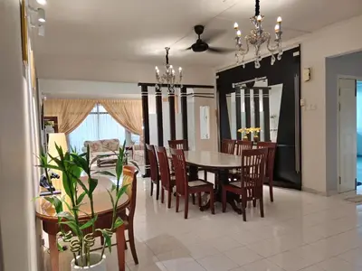 a dining room and living room with a table and chairs at Isabella Villa George Town Penang in George Town