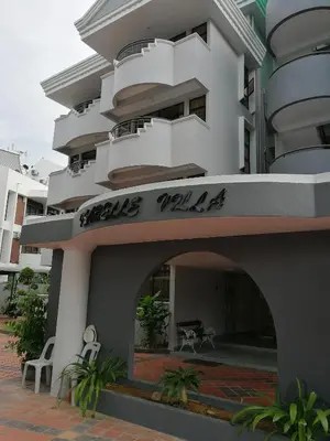 a large white building with a sign on it at Isabella Villa George Town Penang in George Town