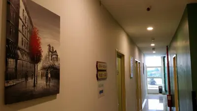 a hallway with a painting on the wall at Amigo Hotel in Seri Iskandar
