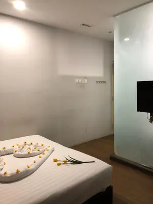 a room with a table with a plate with food on it at Amigo Hotel in Seri Iskandar
