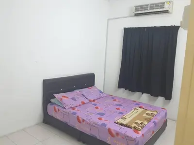 a small bedroom with a bed in a room at The Simple Homestay in Simpang Pulai