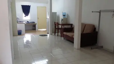 a living room with a couch and a table at The Simple Homestay in Simpang Pulai