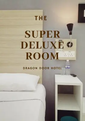 a bedroom with a bed and a sign that reads the super deliver room at Dragon Door Hotel in Sitiawan
