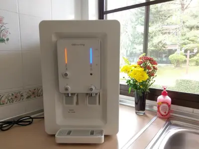 a white appliance on a kitchen counter next to a sink at Mary Apt @ Equatorial Hill Resort in Cameron Highlands