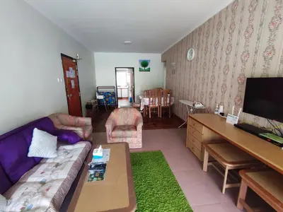a living room with a couch and a table at Mary Apt @ Equatorial Hill Resort in Cameron Highlands