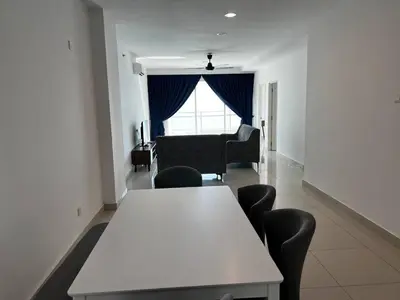 a white table and chairs in a room with a couch at Merlene Suites at Mansion One Formerly know as Mansion One Suites in George Town
