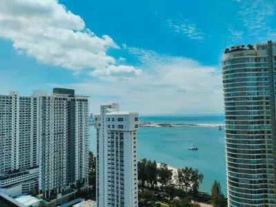 a view of a city with tall buildings and the ocean at Merlene Suites at Mansion One Formerly know as Mansion One Suites in George Town