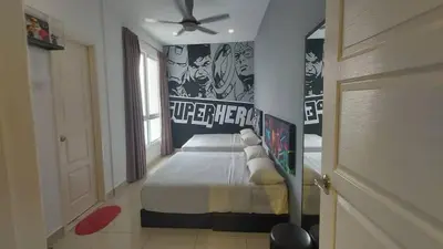 a bedroom with a bed and a ceiling fan at Merlene Suites at Mansion One Formerly know as Mansion One Suites in George Town