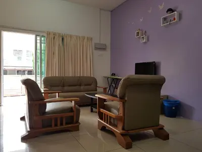 a living room with two chairs and a couch at Comfort On the Hill in Cameron Highlands