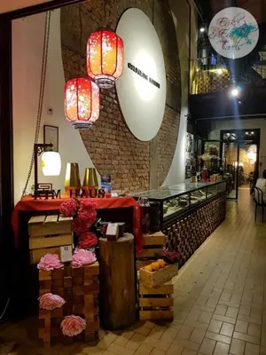 a restaurant with a counter and lights on the wall at Kim Haus Loft in George Town
