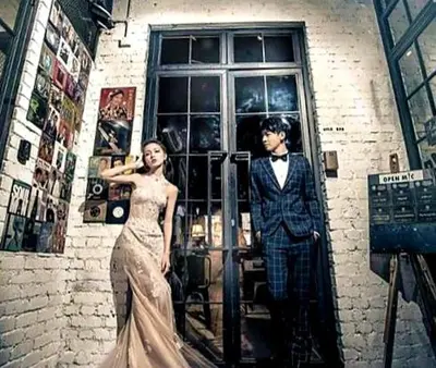 a man and a woman standing in front of a building at Kim Haus Loft in George Town