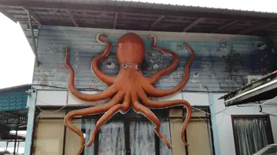 an orange octopus on the side of a building at Pangkor Home Sea Village in Pangkor