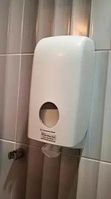 a toilet paper dispenser on the wall of a bathroom at Pangkor Home Sea Village in Pangkor
