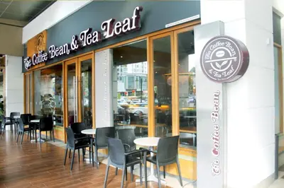 a restaurant with tables and chairs in front of it at 118 Residences by Travovo in George Town