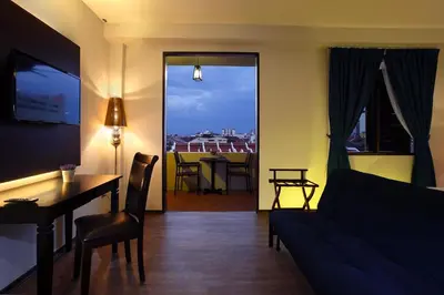 a living room with a couch and a table at Kimberley Hotel Georgetown in George Town