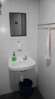 a bathroom with a sink and a mirror at CEO SoHo Suite - biz or holiday 2-5 Pax in Bayan Lepas