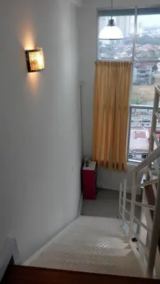 a small room with a staircase and a window at CEO SoHo Suite - biz or holiday 2-5 Pax in Bayan Lepas